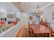 Open-concept dining area with hardwood floors and views into the living spaces at 3924 Sunset Maple Ct, Raleigh, NC 27612