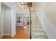 Grand foyer with staircase, hardwood floors, and views into the living spaces at 3924 Sunset Maple Ct, Raleigh, NC 27612
