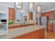 Eat-in kitchen features stainless steel appliances, beautiful backsplash and an island at 3924 Sunset Maple Ct, Raleigh, NC 27612
