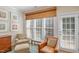 Cozy sitting room featuring a large window, comfortable seating, and a side table at 3924 Sunset Maple Ct, Raleigh, NC 27612