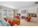 Cozy living room with fireplace, built-in shelves, and comfortable seating arrangement at 3924 Sunset Maple Ct, Raleigh, NC 27612