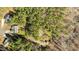 An overhead shot of a home surrounded by a lush green forest at 40 Paddle Wheel Ct, Franklinton, NC 27525