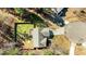 An aerial shot of a home with fenced yard, deck and lush greenery at 40 Paddle Wheel Ct, Franklinton, NC 27525