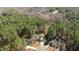 Aerial view of a charming home nestled among lush green trees in a quiet neighborhood at 40 Paddle Wheel Ct, Franklinton, NC 27525