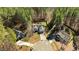 An overhead shot of a home situated among mature trees in a Gathering-friendly neighborhood at 40 Paddle Wheel Ct, Franklinton, NC 27525