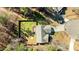 A view from above highlighting the fenced backyard, deck and tree-filled surroundings at 40 Paddle Wheel Ct, Franklinton, NC 27525