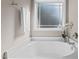 Clean bathroom featuring a large soaking tub with decorative accents and bright lighting at 40 Paddle Wheel Ct, Franklinton, NC 27525