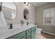 Bathroom with a dual sink vanity and a modern design with a large framed mirror at 40 Paddle Wheel Ct, Franklinton, NC 27525