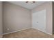 Carpeted bedroom features a ceiling fan, window, and closet at 40 Paddle Wheel Ct, Franklinton, NC 27525