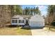 Charming single Gathering home featuring a 2-car garage, black shutters and attractive landscaping at 40 Paddle Wheel Ct, Franklinton, NC 27525