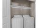 Convenient laundry room includes a washer, dryer, and shelving for storage at 40 Paddle Wheel Ct, Franklinton, NC 27525