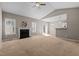 Bright living room features vaulted ceiling, fireplace, ceiling fan, and seamless flow to dining area at 40 Paddle Wheel Ct, Franklinton, NC 27525