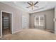 Spacious primary bedroom features tray ceiling, ceiling fan, and ample natural light at 40 Paddle Wheel Ct, Franklinton, NC 27525