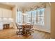 Breakfast nook with a circular table and wooded views at 44 Ashwood Dr, Chapel Hill, NC 27516