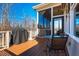 Outdoor deck features a table, grill, and seating, perfect for entertaining or enjoying the view at 44 Ashwood Dr, Chapel Hill, NC 27516