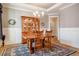 Traditional dining room with wood table, area rug, and wainscoting at 44 Ashwood Dr, Chapel Hill, NC 27516