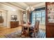 Traditional dining room with wood table, area rug, and ample natural light at 44 Ashwood Dr, Chapel Hill, NC 27516
