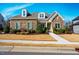 Charming front exterior showcases lush landscaping, stone accents, and inviting entrance at 44 Ashwood Dr, Chapel Hill, NC 27516