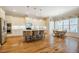 Bright kitchen features a large island with seating, stainless appliances, and hardwood floors at 44 Ashwood Dr, Chapel Hill, NC 27516