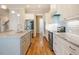 Gourmet kitchen features sleek stainless steel appliances and a granite center island at 44 Ashwood Dr, Chapel Hill, NC 27516