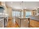 Open kitchen with a large island and stainless steel appliances, seamlessly connected to the living area at 44 Ashwood Dr, Chapel Hill, NC 27516