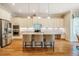 Spacious kitchen with a large island with seating and stainless steel appliances at 44 Ashwood Dr, Chapel Hill, NC 27516