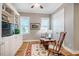 Bright living room offering custom bookshelves, hardwood flooring, and plush seating with natural light at 44 Ashwood Dr, Chapel Hill, NC 27516