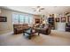Spacious living room showcasing comfortable seating, neutral carpet, and decor on display at 44 Ashwood Dr, Chapel Hill, NC 27516