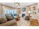 Cozy living room with a fireplace, built-in bookshelves, and access to an outdoor deck at 44 Ashwood Dr, Chapel Hill, NC 27516