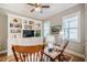 Cozy living room featuring custom bookshelves, light gray walls, hardwood flooring, and plush seating at 44 Ashwood Dr, Chapel Hill, NC 27516