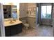 Full bath featuring a vanity with dark cabinetry, combined shower and tub, and lots of storage at 4401 Sprague Rd, Raleigh, NC 27613