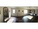 Large bonus room with dark wood flooring, ballet barre, and built in shelving and storage at 4401 Sprague Rd, Raleigh, NC 27613