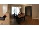 Adjacent to the kitchen is dining room with a wooden table and views of the porch at 4401 Sprague Rd, Raleigh, NC 27613