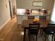Inviting dining room adjacent to the kitchen with a wood table, seating for four, and modern lighting at 4401 Sprague Rd, Raleigh, NC 27613
