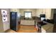 Bright kitchen boasts white cabinetry, stainless steel appliances, and granite countertops at 4401 Sprague Rd, Raleigh, NC 27613