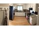 Bright kitchen boasts white cabinetry, stainless steel appliances, and granite countertops at 4401 Sprague Rd, Raleigh, NC 27613