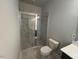 Bathroom featuring marble tiled shower and glass door at 502 Yeowell Dr, Chapel Hill, NC 27514