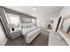 Bedroom featuring neutral tones, a patterned bedspread, and bright natural light at 502 Yeowell Dr, Chapel Hill, NC 27514