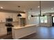 Spacious kitchen with a kitchen island, white cabinets, stainless steel appliances, and open floor plan at 502 Yeowell Dr, Chapel Hill, NC 27514
