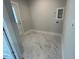 A well lit laundry area with marble tile flooring offers a clean space for household tasks at 502 Yeowell Dr, Chapel Hill, NC 27514