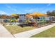 Colorful playground with shades and seating, perfect for Gathering fun in the community at 502 Yeowell Dr, Chapel Hill, NC 27514