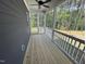 A wooden screened in porch offers a relaxing space to enjoy the outdoors in comfort at 502 Yeowell Dr, Chapel Hill, NC 27514