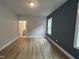 A bright bedroom features luxury vinyl plank flooring and neutral paint at 504 Yeowell Dr, Chapel Hill, NC 27514