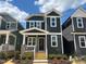 Two-story home featuring a symmetrical facade, inviting entryway, and modern architectural details at 504 Yeowell Dr, Chapel Hill, NC 27514