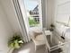 Bright office nook featuring a sleek desk, contemporary chair, and large window with pleasant views at 504 Yeowell Dr, Chapel Hill, NC 27514