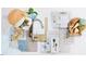 An artistic display of kitchen components, complete with a basket of food and wine and flowers at 504 Yeowell Dr, Chapel Hill, NC 27514