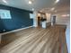 Spacious living room featuring luxury vinyl plank flooring and a modern, open-concept layout at 504 Yeowell Dr, Chapel Hill, NC 27514