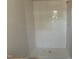 Bright shower featuring clean, white vertical tiling and a neutral-colored base at 504 Yeowell Dr, Chapel Hill, NC 27514