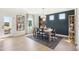 Dining area featuring a modern chandelier and access to the backyard at 52 Commons Cir, Clayton, NC 27520