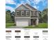 Two-story home with gray siding, brown shutters, white garage door, and well-manicured lawn at 52 Commons Cir, Clayton, NC 27520